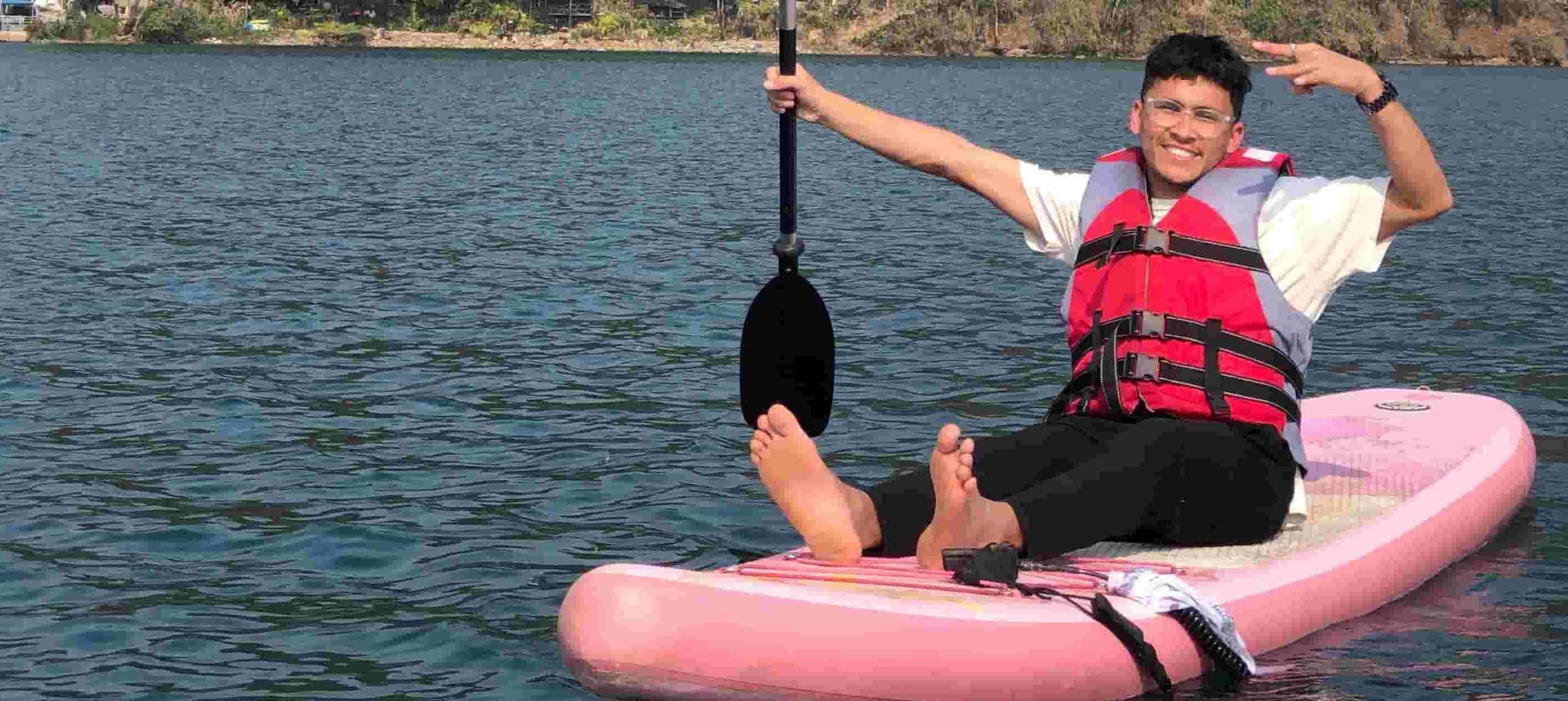 Raja Shahi boating and kayaking on Phewa Lake in Pokhara with lush green hills in the background