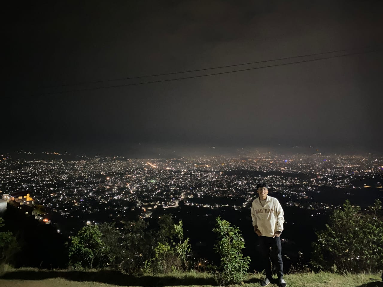 Night panorama of the illuminated city valley from a high vantage point